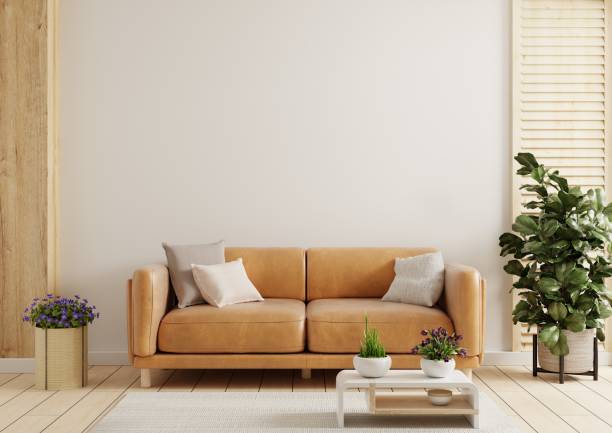 istock Modern living room wall mockup with leather sofa and decor on white background. 1554752579