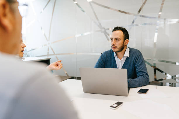 istock Businessman paying attention in meeting 1554758916