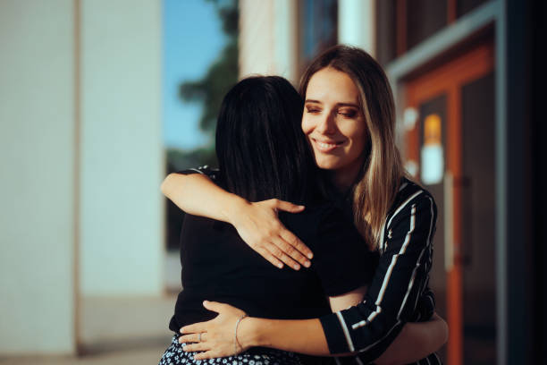 istock Friends Meeting and Hugging in a Public Place 1554764677