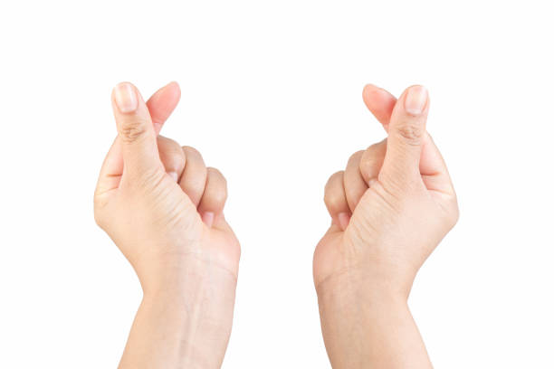 istock Asian woman makes her hand like a mini heart shape 1554769545