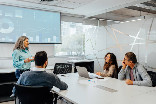 istock Executive director woman presenting business at meeting 1554769560