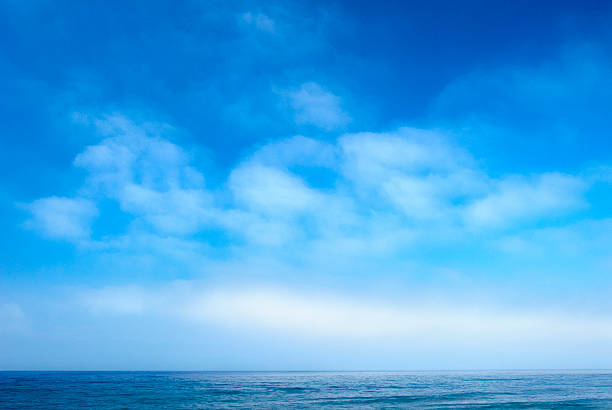 Cloudscape Over Ocean Water stock photo
