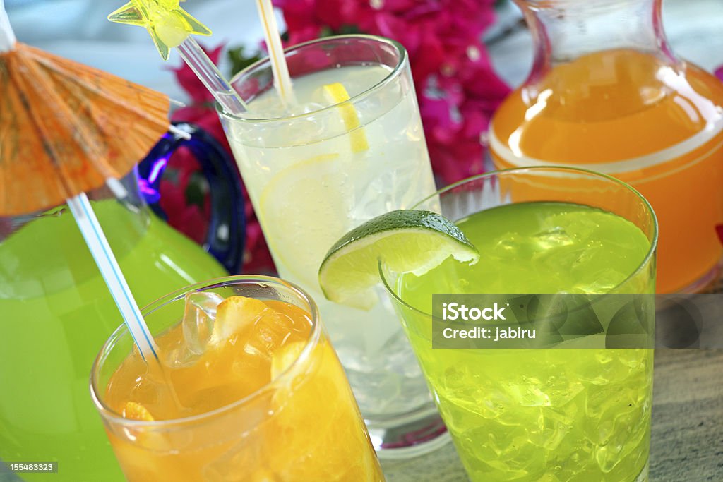 Summer Drinks A selection of summer drinks with ice including lime, orange and lemon. Bougainvillea Stock Photo