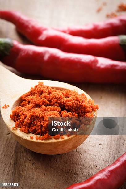 Pepper In Wooden Spoon Stock Photo - Download Image Now - Cayenne Pepper, Cayenne Powder, Chili Pepper