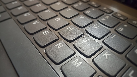 Close up of keys on a black computer keyboard