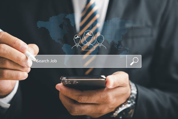 istock A man holding smart phone with find a job on screen 1554865288