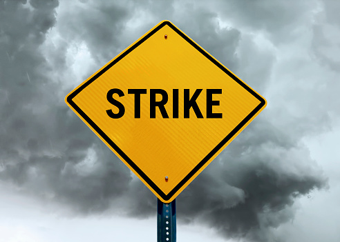 “Strike traffic sign in front of a dramatic sky