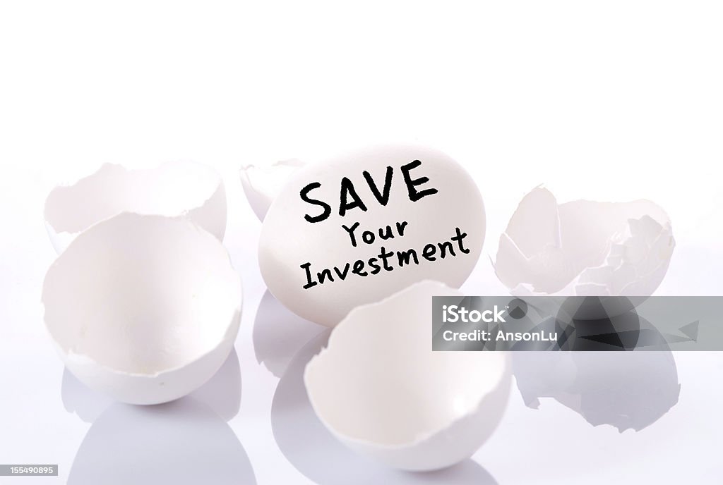 Save your investment Save your investment. Egg and broken eggshells on white background Animal Egg Stock Photo