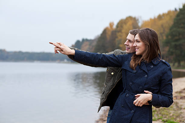 istock young couple looks and show in what 155491315