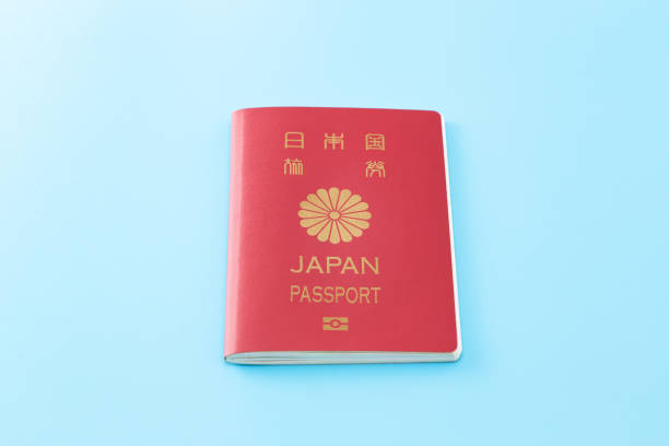 istock Japanese passport on blue background. 1554921144