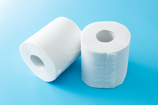 Toilet paper with blue background.