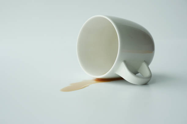 istock cup of coffee spilled on white background 1554923466