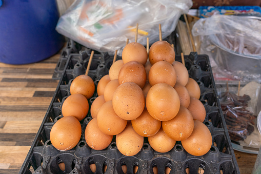 Photo of a popular local thai street food - thai skewed grilled eggs