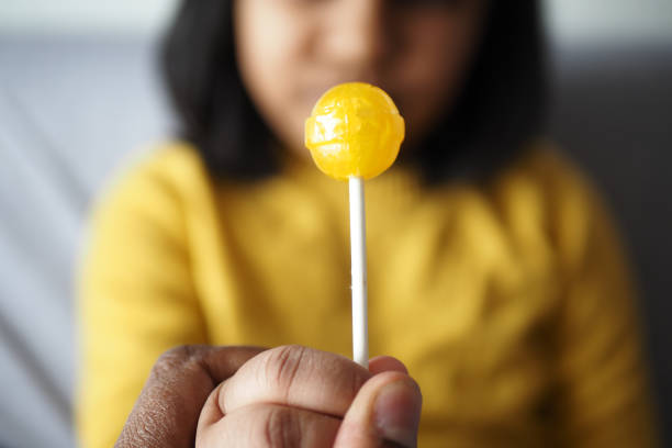 red lollipop isolated on a yellow infinite floor 3DCG