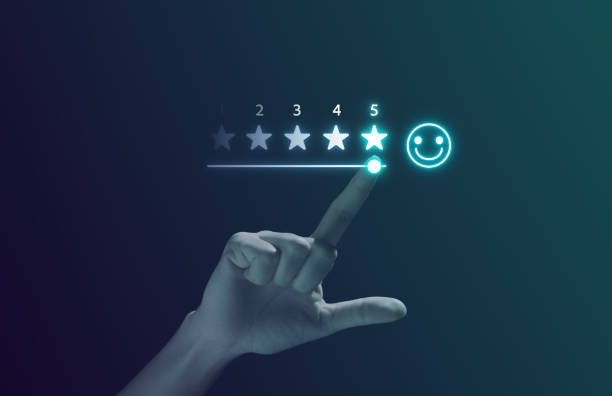 istock Businessman with smiley face emoticon on virtual touch screen 1554927090