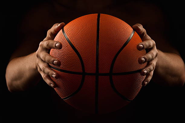 istock Man holding basketball in the dark 155492793