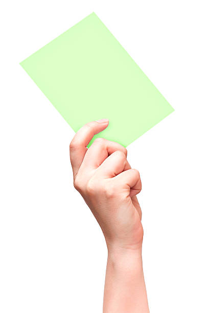 istock Female hand with empty green card isolated on white 155492968