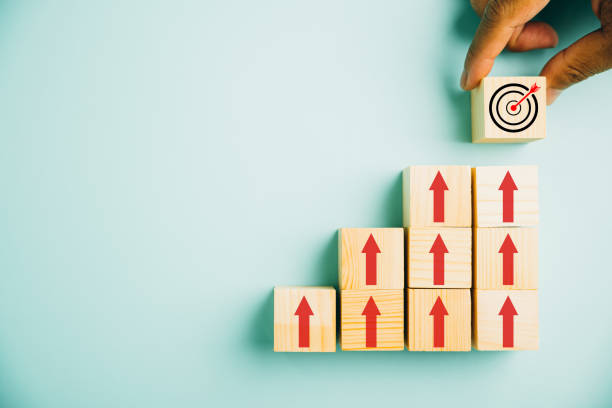 istock Wooden blocks with Target icon on top 1554949692