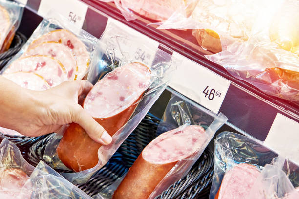 istock Sausage and ham at store 1554997656