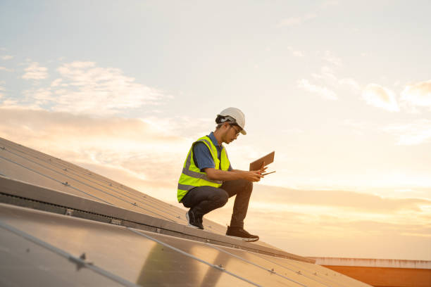 istock Service Engineer use tablet working inspection installation solar cell on the roof. 1555010556