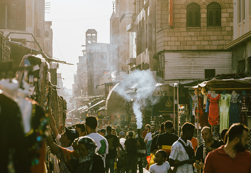 07/14/2023,Cairo,Egypt:Tourists and locals are shopping at Khan al-khalili market in Cairo.Khan al-khalili is the most famous and largest market in Arabia.Traditional mosque and church can be seen in the background.