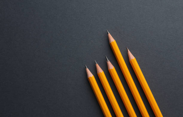 istock Yellow pencils on a dark background. Creativity set 1555044192
