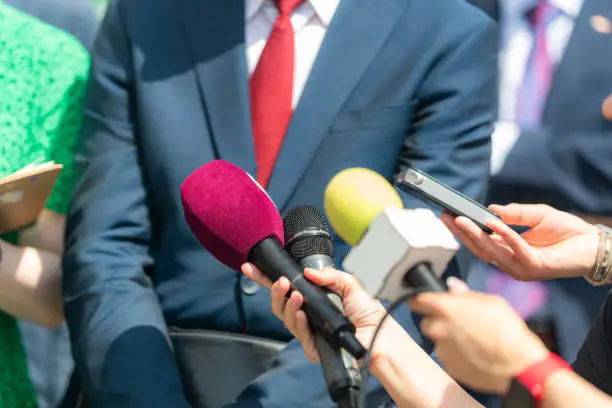 Experience a thought-provoking conversation as journalists engage in an interview with a businessman at a press conference, providing valuable insights and capturing the essence of the event.