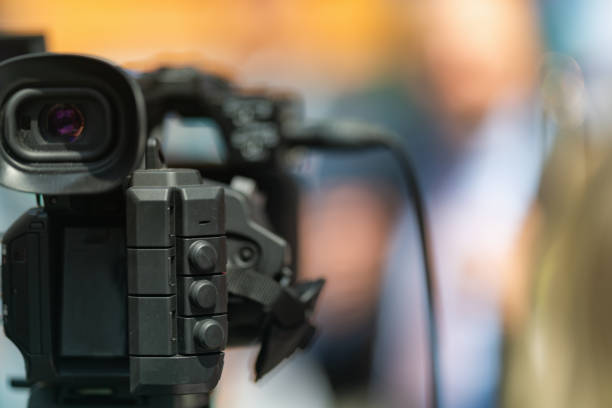 istock Media Presence: Close-Up of TV Camera at Press Conference 1555046321