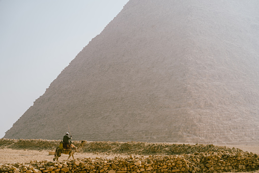 Cairo, Giza - Egypt - March 17, 2023: The great pyramid of Khufu (Cheops) in Giza plateau. Historical Egypt pyramids.
