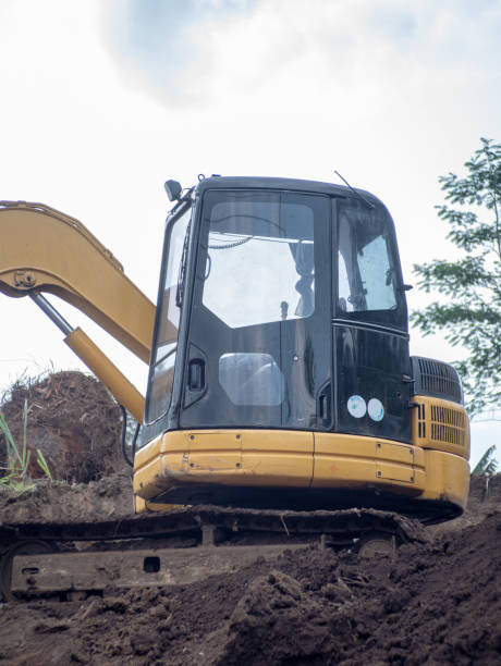 istock excavator loader machine at demolition construction site scratching and moving the ground 1555086397