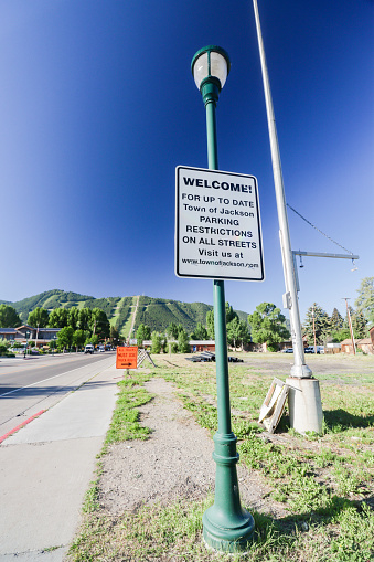 Parking Restrictions Sign on Perry Street at Jackson of Jackson Hole in Teton County, Wyoming. A website is visible.