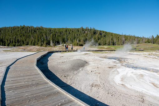 Tourists at Upper Geyser Basin in Yellowstone National Park at Teton County, Wyoming