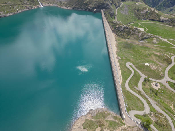 istock Aerial drone view: Concrete dam in the Swiss Alps 1555128227
