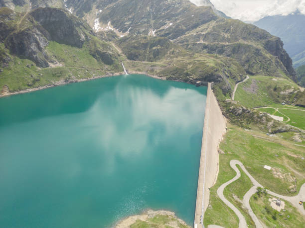 istock Aerial drone view: Concrete dam in the Swiss Alps 1555165784