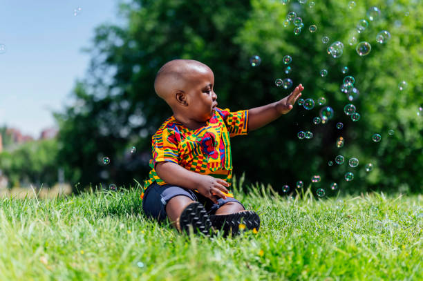 istock African American boy playing with soap bubbles 1555178731