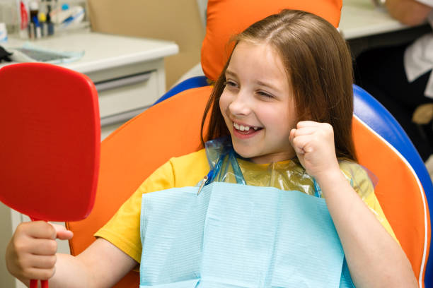 istock Girl on dental appointment. Regular check up teeth 1555185943