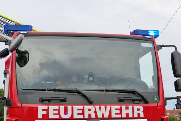 istock Storm damage. Fire truck during the operation. 1555188686
