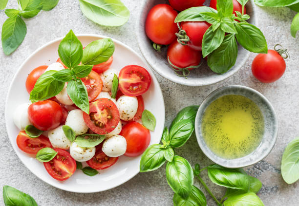 istock Caprese salad with tomatoes, mozzarella and basil. 1555189206