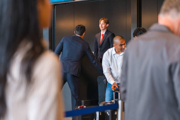 istock Caucasian Airline Steward At A Checking A Boarding Pass 1555214529