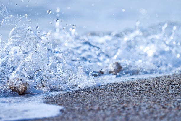 Ocean wave splashing on the beach. Sea wave. Selective focus.