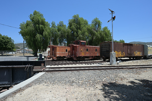 Rusting rolling stock by a turntable at Fillmore, California.