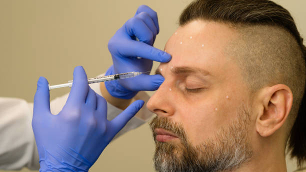 istock Anti-aging treatment on face with botulinum toxin 1555245377