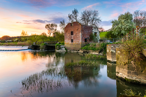 Cutt Mill on the River Stour near Hinton St. Mary, Dorset, stands in ruins as a derelict watermill.