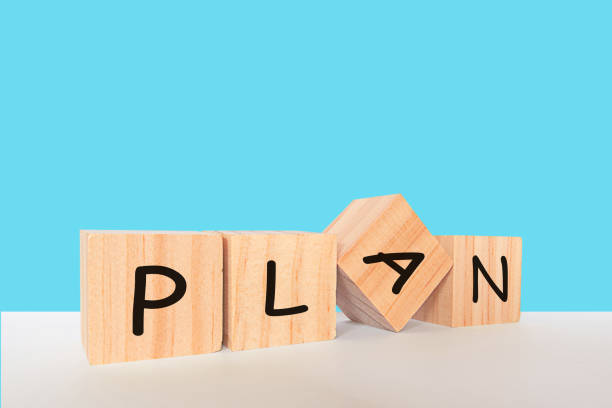 istock Placing a wooden cube block with the text 