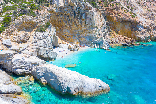 Beautiful sunny coast view to an amazing paradise holiday bay with crystal clear blue water sandy beach, Seychelles, Ikaria island, Greece.