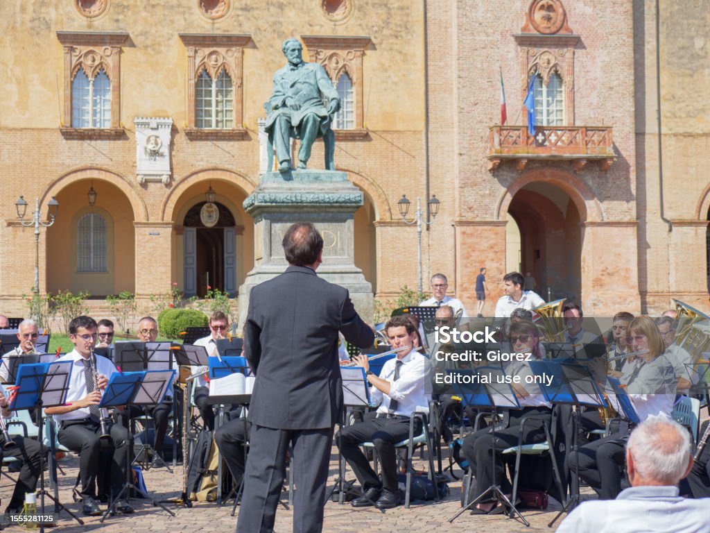 Orchestra Performing Outdoors right in Front of Rocca Pallavicino and the Statue of Giuseppe Verdi, Italian Composer, Parma, Italy Parma, Italy - september 2022: Orchestra Performing Outdoors right in Front of Rocca Pallavicino and the Statue of Giuseppe Verdi, Italian Composer, Parma, Italy. Composer Stock Photo Orchestra Performing Outdoors right in Front of Rocca Pallavicino and the Statue of Giuseppe Verdi, Italian Composer, Parma, Italy Parma, Italy - september 2022: Orchestra Performing Outdoors right in Front of Rocca Pallavicino and the Statue of Giuseppe Verdi, Italian Composer, Parma, Italy. Composer Stock Photo