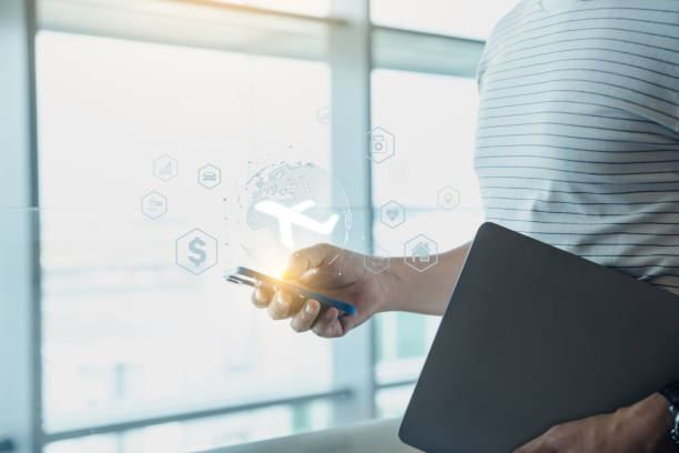 istock Young man using phone with checking travel insurance. 1555288712