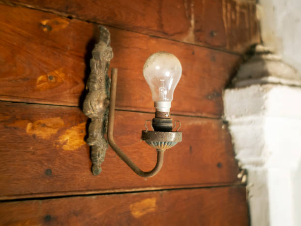 istock old  lamp on wooden wall 1555299042