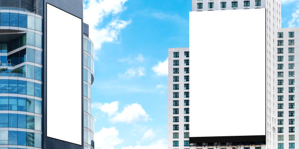 istock Two outdoor billboard on building  with blue sky background 1555299064