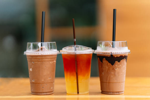 istock Different types of brewed water in glasses for takeaway on table. 1555301776